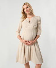 Beige maternity and nursing empire dress for business, baby shower, wedding guest, party, and formal occasions. Sustainable TENCEL, zipper breastfeeding access, and full skirt with deep pockets. Petite and standard sizes.