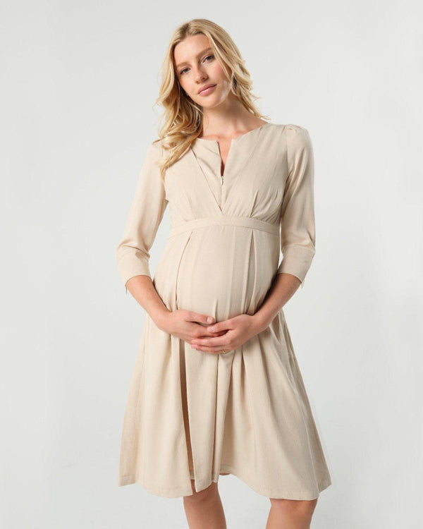 Beige maternity and nursing empire dress for business, baby shower, wedding guest, party, and formal occasions. Sustainable TENCEL, zipper breastfeeding access, and full skirt with deep pockets. Petite and standard sizes.