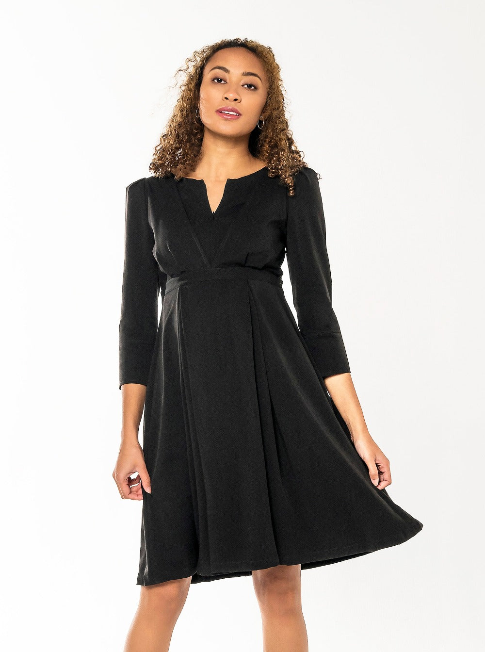 Black maternity and nursing dresses by MARION. Sustainable TENCEL empire waist style with deep pockets and full feminine skirt. Breastfeeding friendly with 3/4 sleeves and elegant cuff detail.