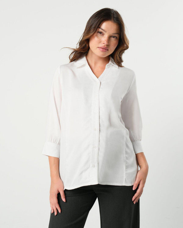 White maternity button down shirt for pregnancy and nursing. Maternity workwear top with no gap technology. Cut with luxury sustainable TENCEL for the office, the courtroom, or Saturday errands.