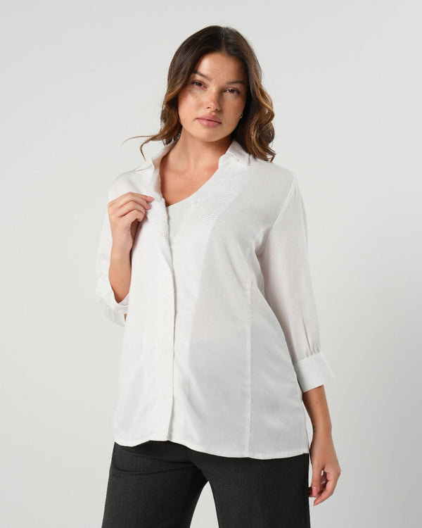 White maternity button down shirt for pregnancy and nursing. Maternity workwear top with no gap technology. Cut with luxury sustainable TENCEL for the office, the courtroom, or Saturday errands.