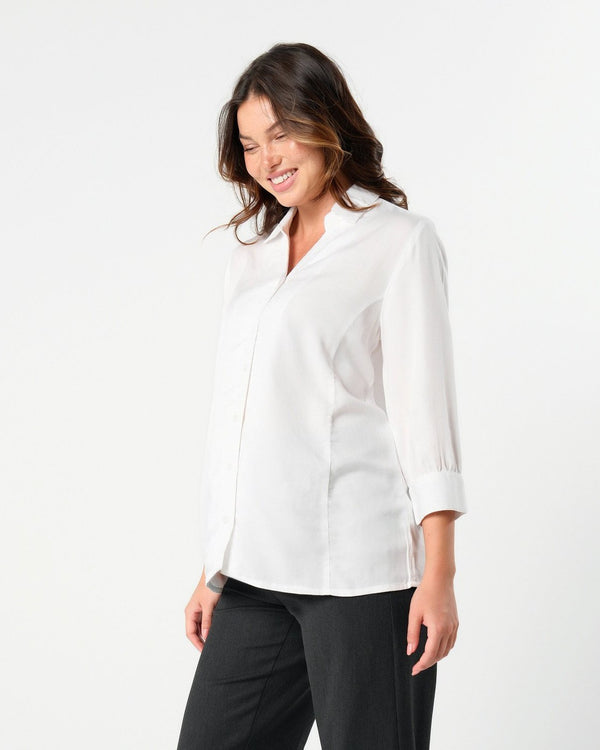 White maternity button down shirt for pregnancy and nursing. Maternity workwear top with no gap technology. Cut with luxury sustainable TENCEL for the office, the courtroom, or Saturday errands.