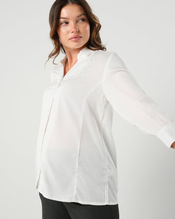 White maternity button down shirt for pregnancy and nursing. Maternity workwear top with no gap technology. Cut with luxury sustainable TENCEL for the office, the courtroom, or Saturday errands.