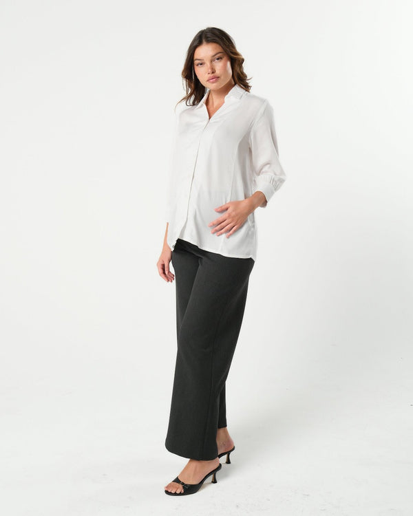 White maternity button down shirt for pregnancy and nursing. Maternity workwear top with no gap technology. Cut with luxury sustainable TENCEL for the office, the courtroom, or Saturday errands.