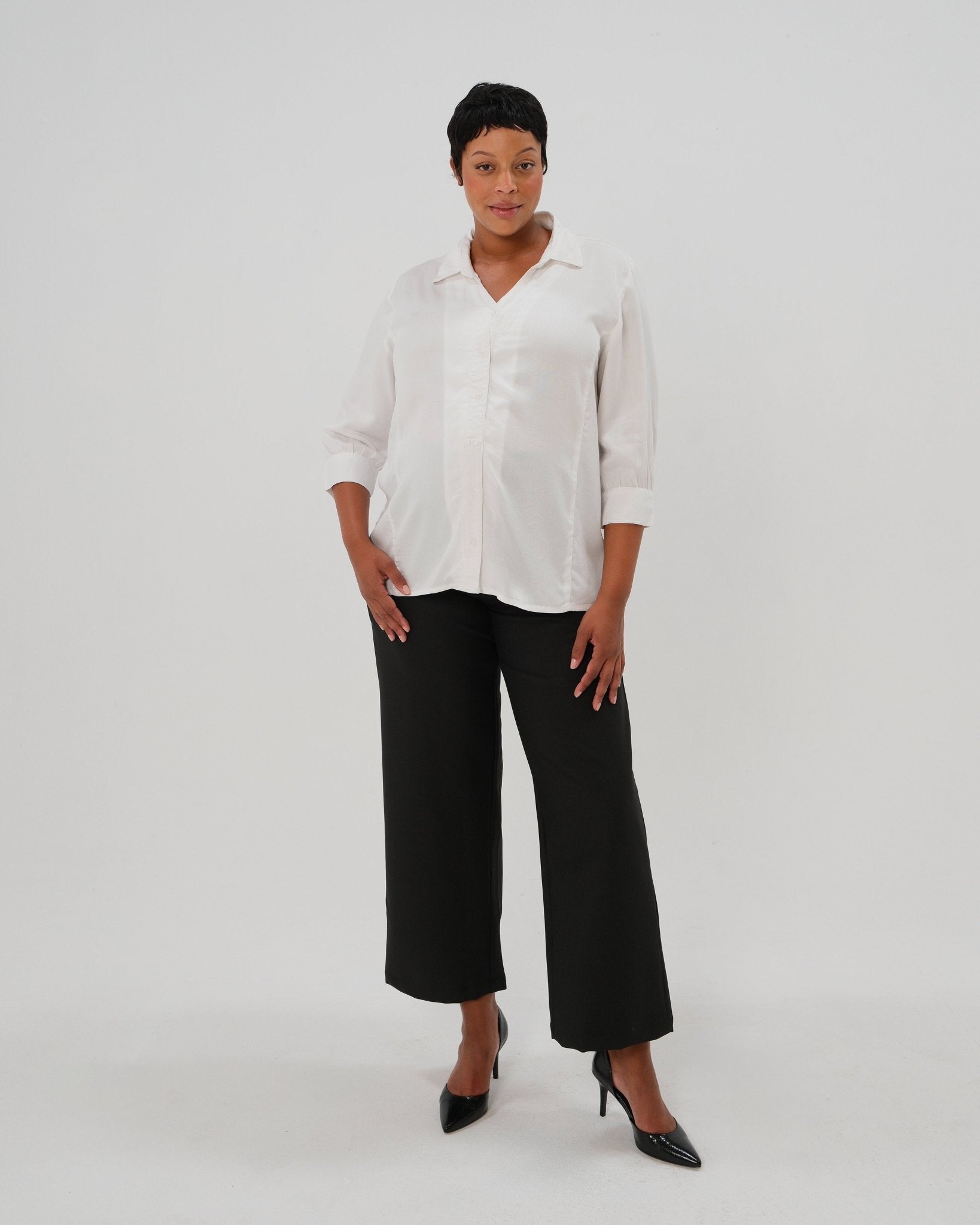 Plus size white maternity button down shirt for pregnancy and nursing by MARION with numerous 5-star reviews. Maternity workwear top with no gap technology that prevents your bra from showing. Cut with luxury sustainable TENCEL, this classic blouse is the best possible choice for your business meeting at the office, the courtroom, or Saturday errands and dinner. For 2026, now available in petite and plus sizes; made for pregnancy, nursing, postpartum, and womenswear. Sold by Nordstrom and Bloomingdale&#39;s.