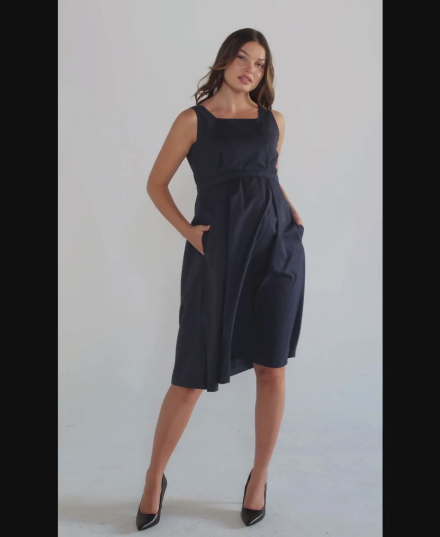 Luxury blue sleeveless maternity dress, from MARION's collection of elevated maternity and nursing dresses. Sustainable, available in standard and petite maternity sizes. Features designer breastfeeding access. Perfect maternity wedding guest dress, baby shower dress, or maternity tea party dress.