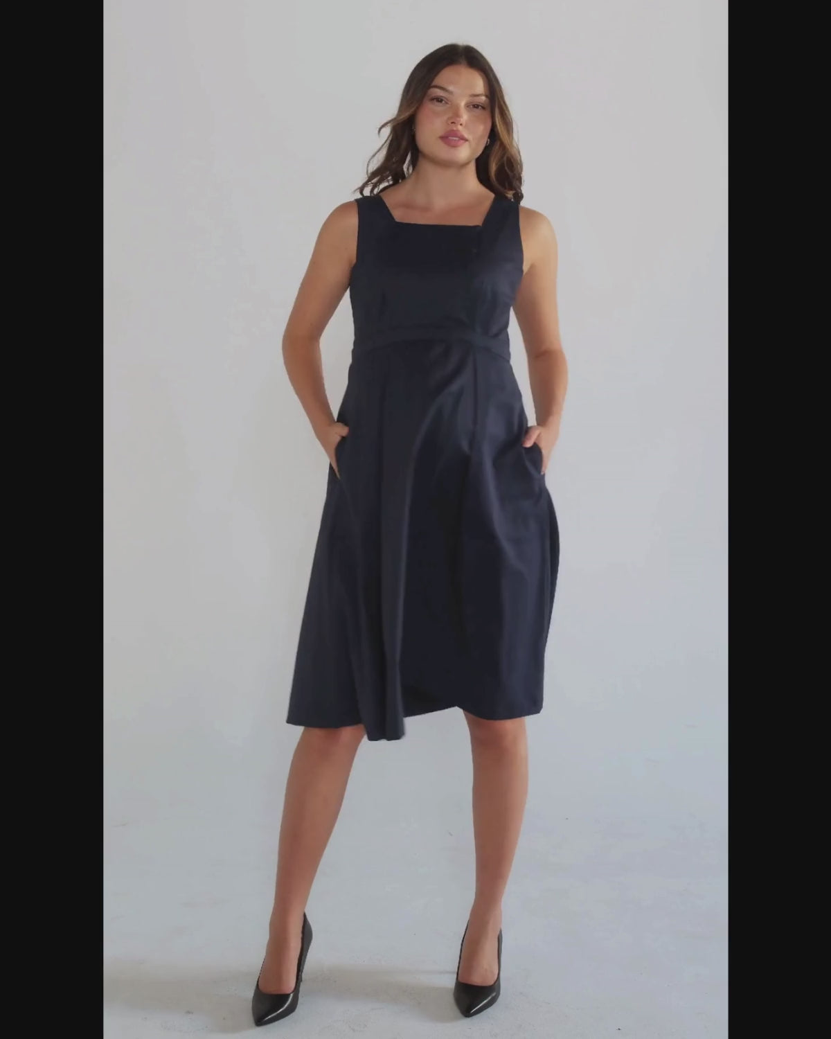 Luxury blue sleeveless maternity dress, from MARION's collection of elevated maternity and nursing dresses. Sustainable, available in standard and petite maternity sizes. Features designer breastfeeding access. Perfect maternity wedding guest dress, baby shower dress, or maternity tea party dress.