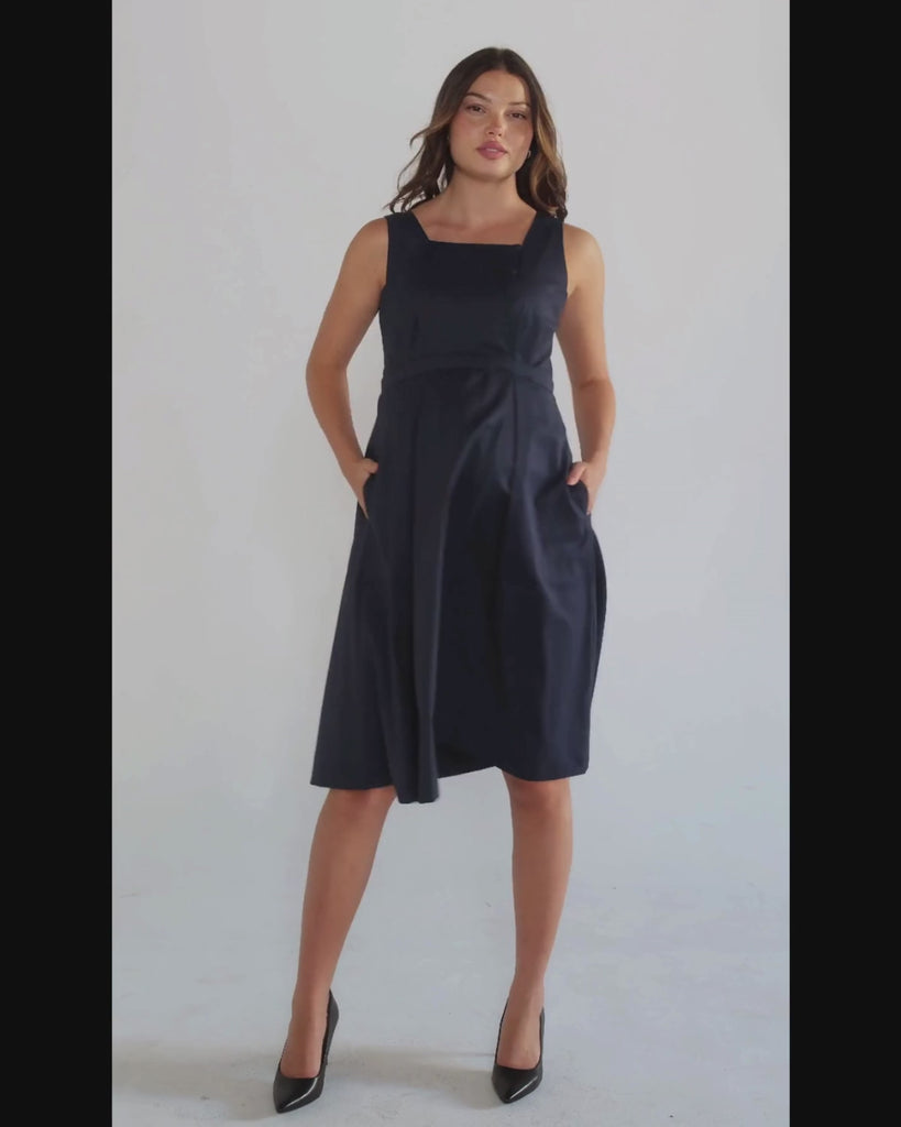 Luxury blue sleeveless maternity dress, from MARION's collection of elevated maternity and nursing dresses. Sustainable, available in standard and petite maternity sizes. Features designer breastfeeding access. Perfect maternity wedding guest dress, baby shower dress, or maternity tea party dress.