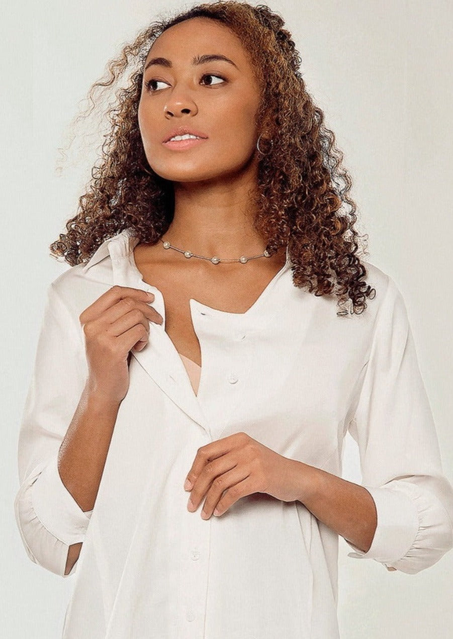White Maternity Workwear Button Down Blouse. Breastfeeding Top. MARION offers the best sustainable maternity office wear collection on the market. Petite and standard sizes available.