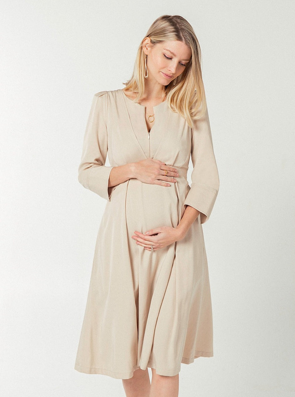 Beige maternity and nursing empire dress for work, baby shower, and formal occasions. Sustainable TENCEL, zipper breastfeeding access, and full skirt with deep pockets. Petite and standard sizes.