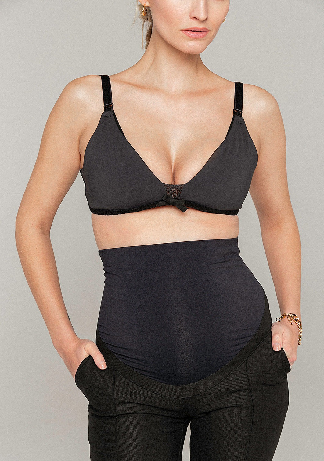 Black wireless maternity and nursing bra with lace details. Made from recycled Polyester and Spandex. 