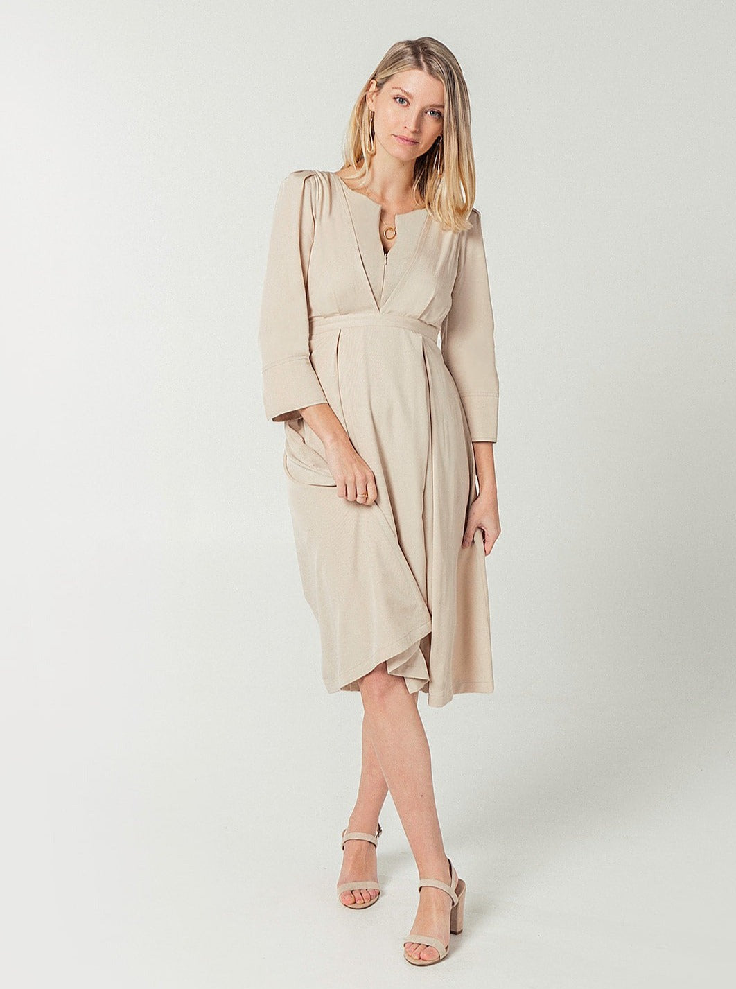 Nude maternity and breastfeeding dress for work, party, and event. TENCEL with empire waist, zipper nursing access, and full skirt with pockets. Sustainable. Beige.