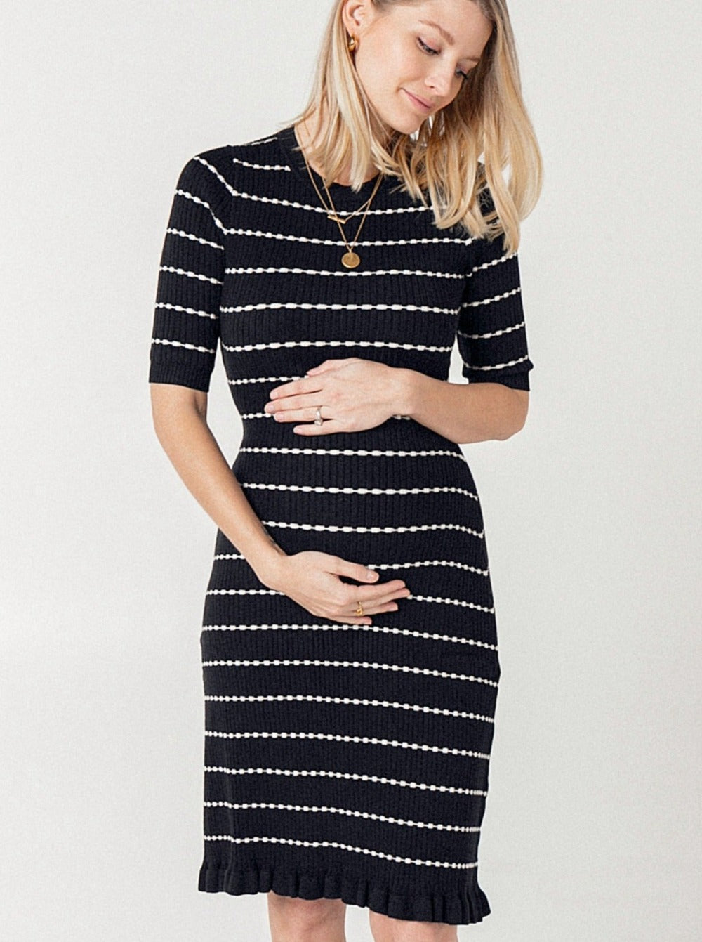 Striped knit maternity sweater dress. This flattering pregnancy dress by MARION features 3/4 sleeves, luxury cotton knit fabric, classic round neck, and feminine hemline. Maternity workwear, maternity wedding guest dress, or baby shower dress. Petite friendly.