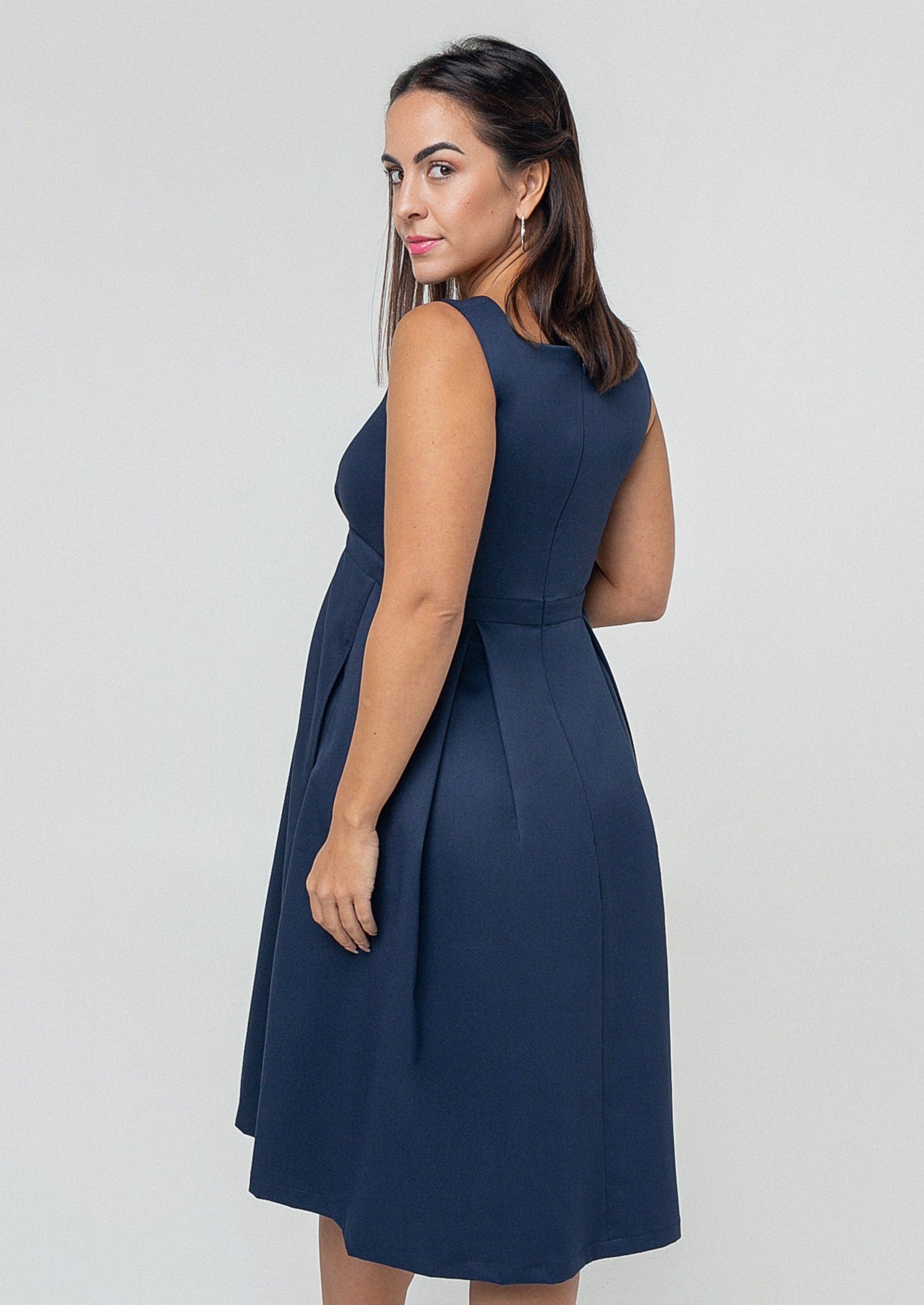 Blue petite maternity dress, nursing dresses, fancy style with empire waist, pockets, and designer breastfeeding access. Made with luxury navy Italian fabric, washable, sustainable.
